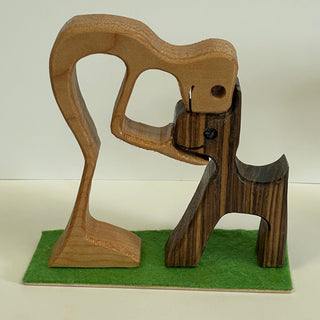 Ron Acton - Wood - Boy kissing head of dog -  - Wood Art - McMillan Arts Centre & MAC Box Office