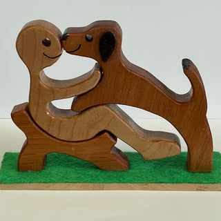 Ron Acton - Wood - Boy in chair with his dog -  - Wood Art - McMillan Arts Centre & MAC Box Office