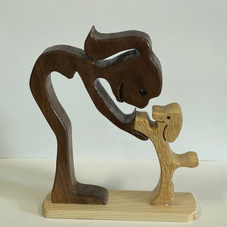 Ron Acton - Wood - Girl with pony tail and her little dog -  - Wood Art - McMillan Arts Centre & MAC Box Office