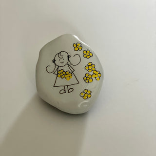 Dana Wagner - Rock Art - Girl surrounded by yellow flowers, large - Dana Wagner - McMillan Arts Centre Gallery, Gift Shop and Box Office - Vancouver Island Art Gallery